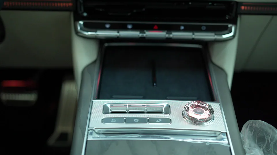Close view of vehicle console controls and materials